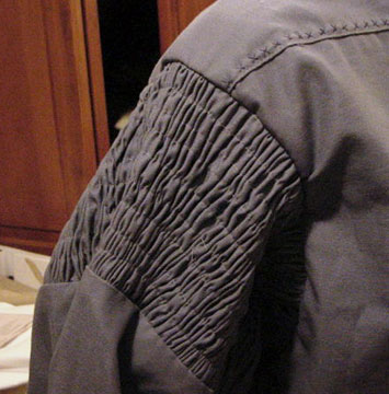 Detail of smocking on shirt sleeve